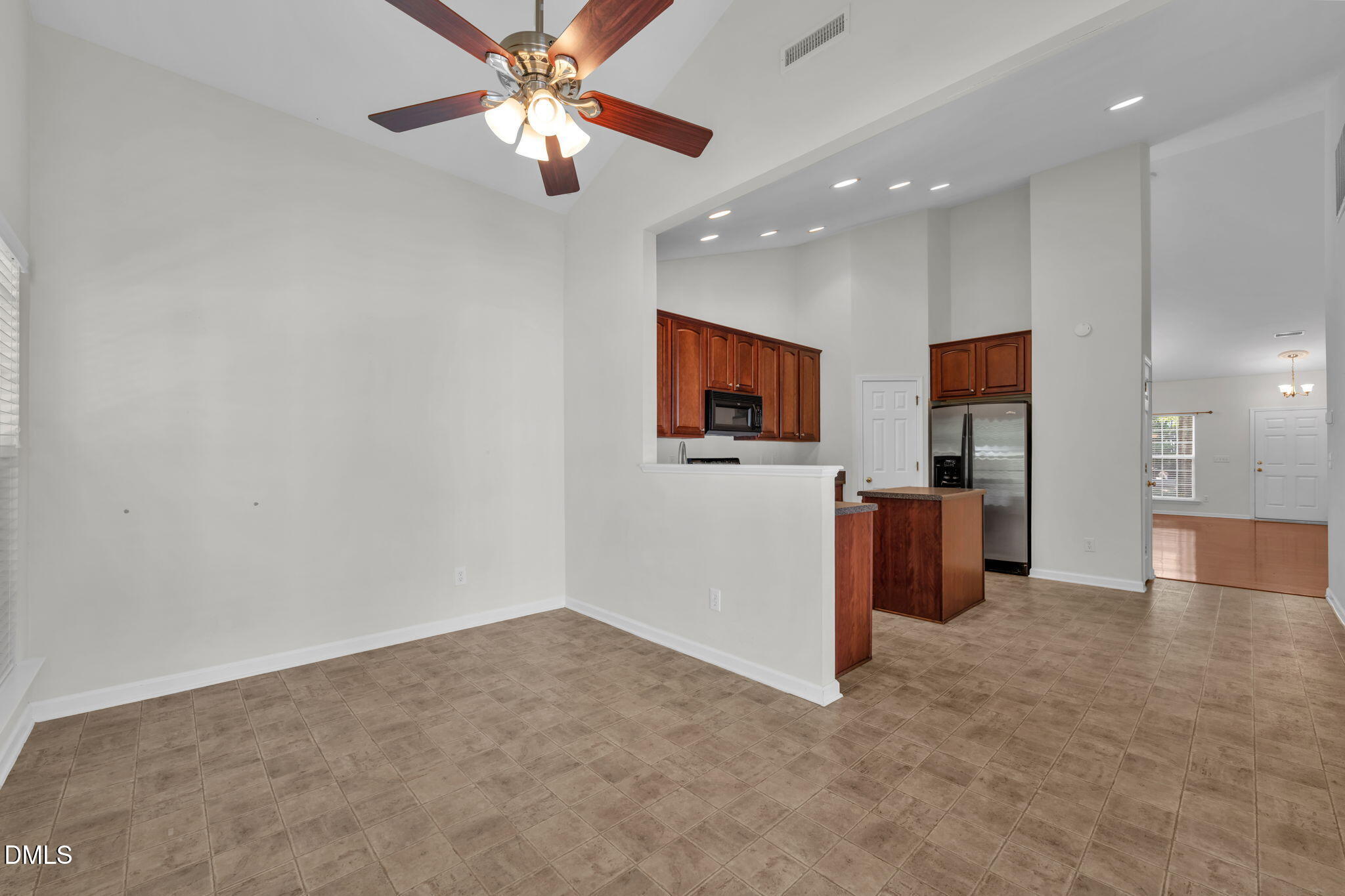 12014 Fox Valley Street Raleigh, NC 27614 - Photo 12 of 42 a view of a livingroom with a flat screen tv