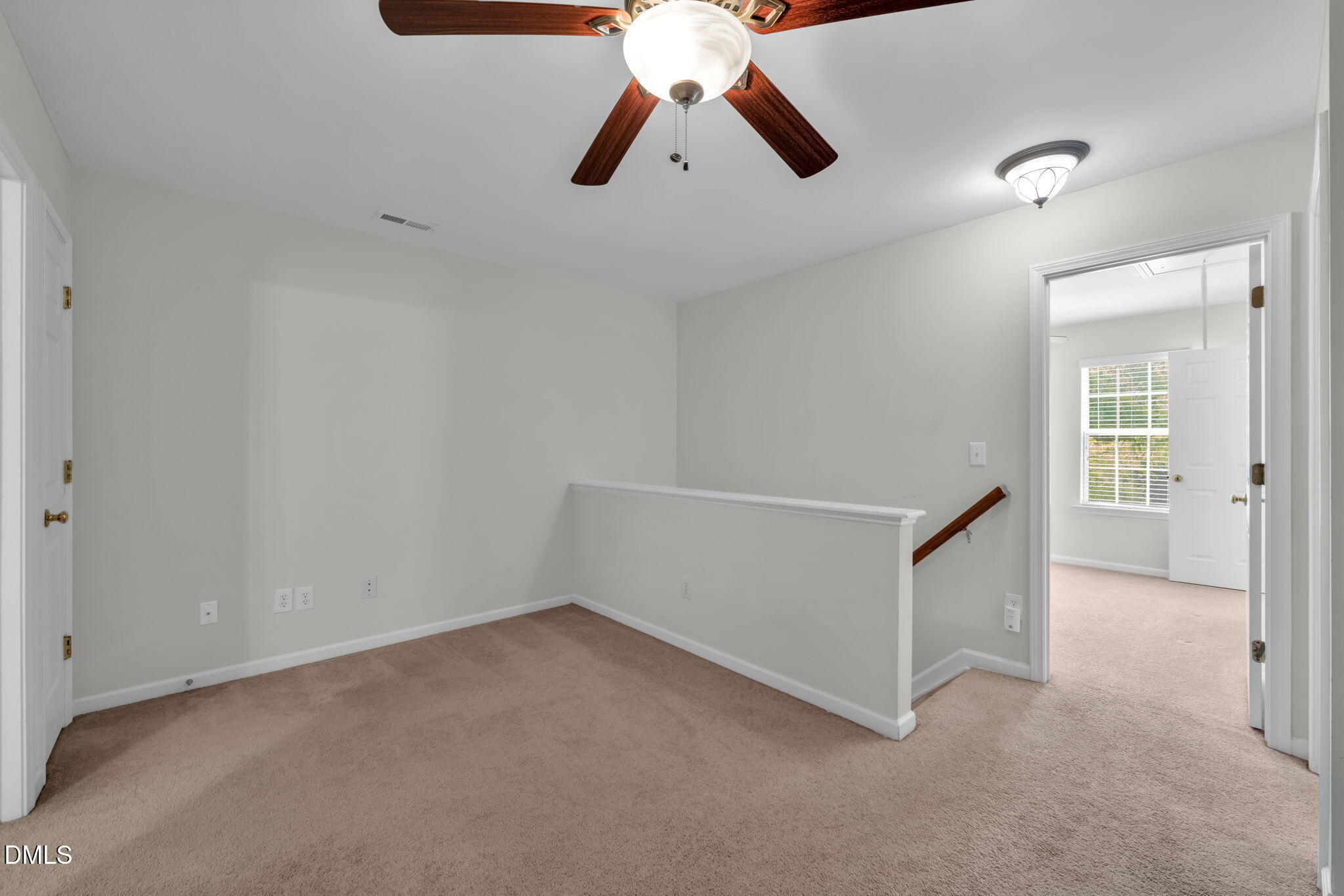 12014 Fox Valley Street Raleigh, NC 27614 - Photo 22 of 42 a view of an empty room with chandelier fan