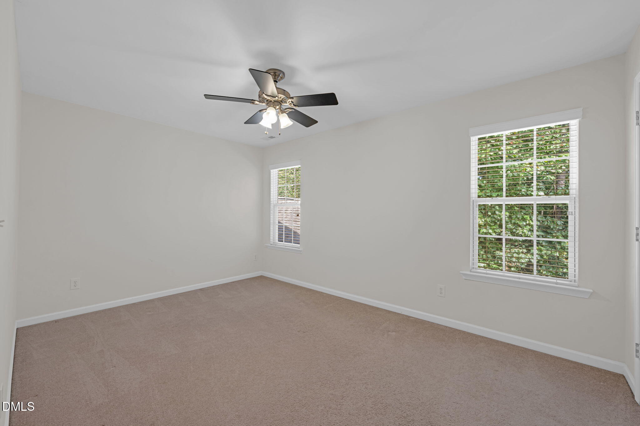 12014 Fox Valley Street Raleigh, NC 27614 - Photo 25 of 42 an empty room with a window and a fan