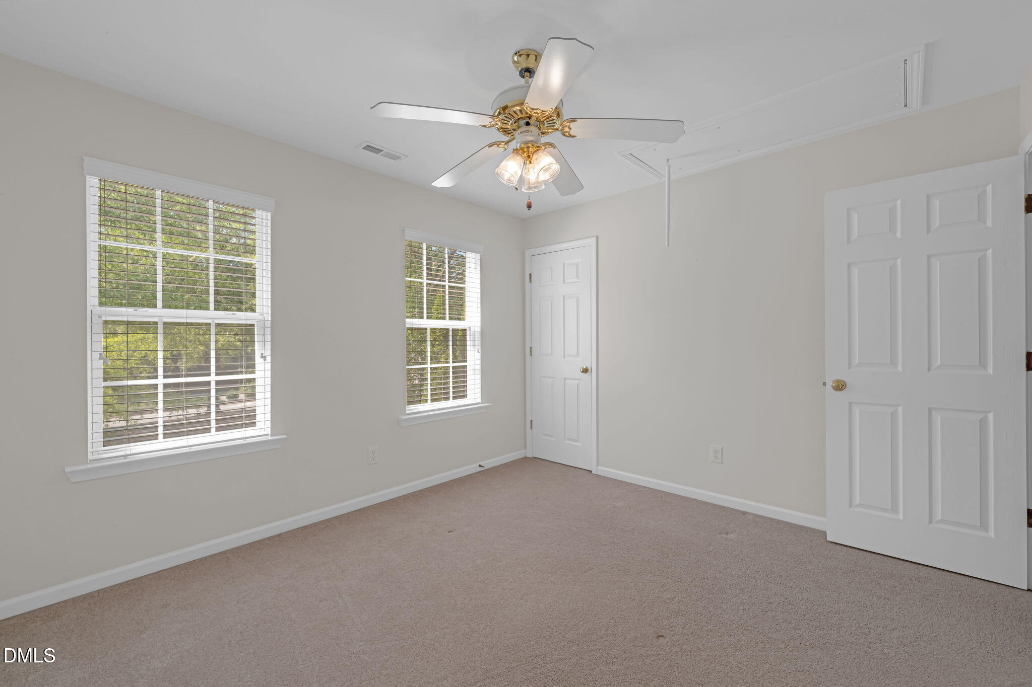 12014 Fox Valley Street Raleigh, NC 27614 - Photo 30 of 42 an empty room with window and chandelier fan