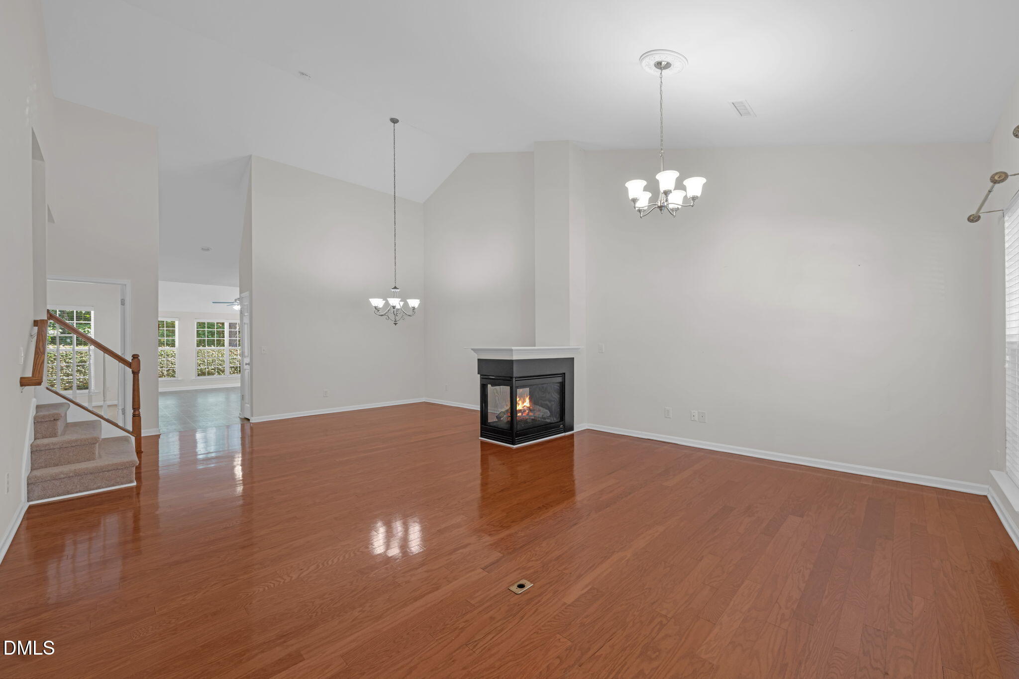 12014 Fox Valley Street Raleigh, NC 27614 - Photo 6 of 42 a view of a livingroom with wooden floor