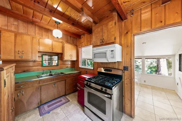 a kitchen with stainless steel appliances granite countertop a stove and a sink