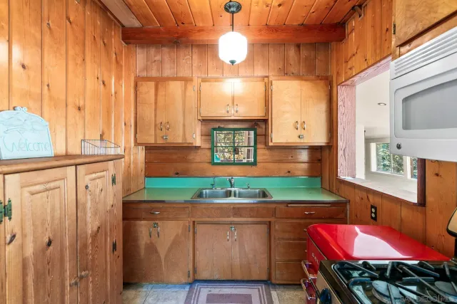 a kitchen with a refrigerator and countertop