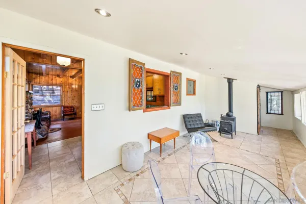 a dining room with furniture and wooden floor