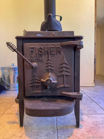 a bedroom with a bed next to a window