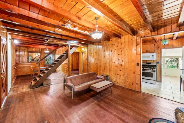 a room with wooden floor and furniture