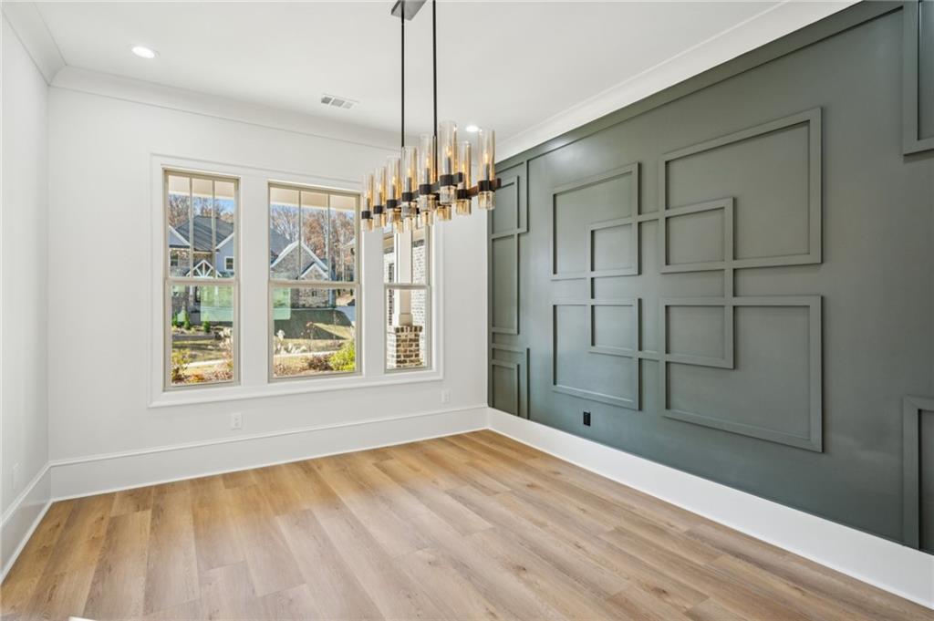 4546 Fawn Path Gainesville, GA 30506 - Photo 11 of 64 a view of empty room with wooden floor and fan