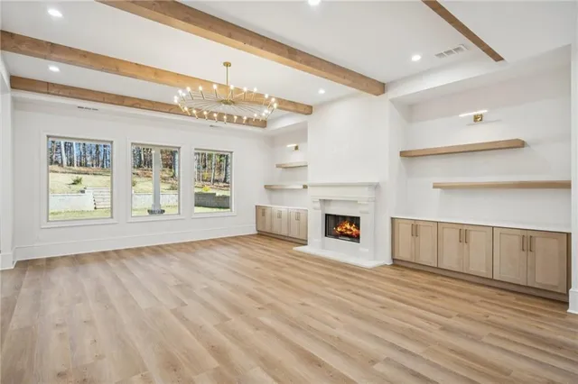 a view of a kitchen with an empty space and a fireplace