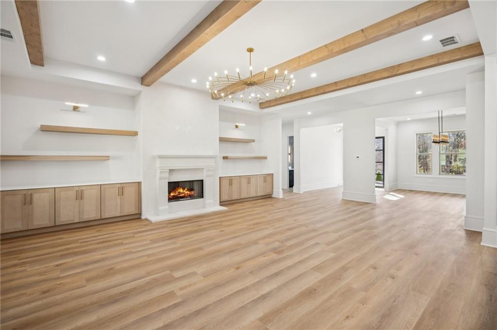 4546 Fawn Path Gainesville, GA 30506 - Photo 17 of 64 a view of a kitchen with an empty space and a fireplace