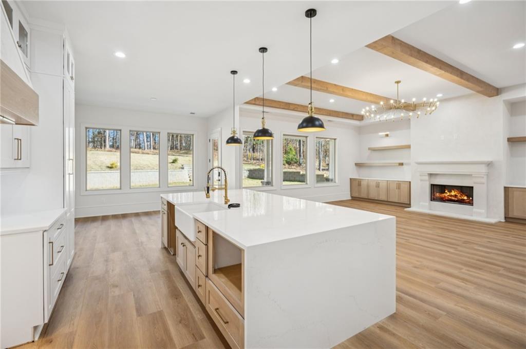 4546 Fawn Path Gainesville, GA 30506 - Photo 20 of 64 a large white kitchen with a large window a oven and a counter space