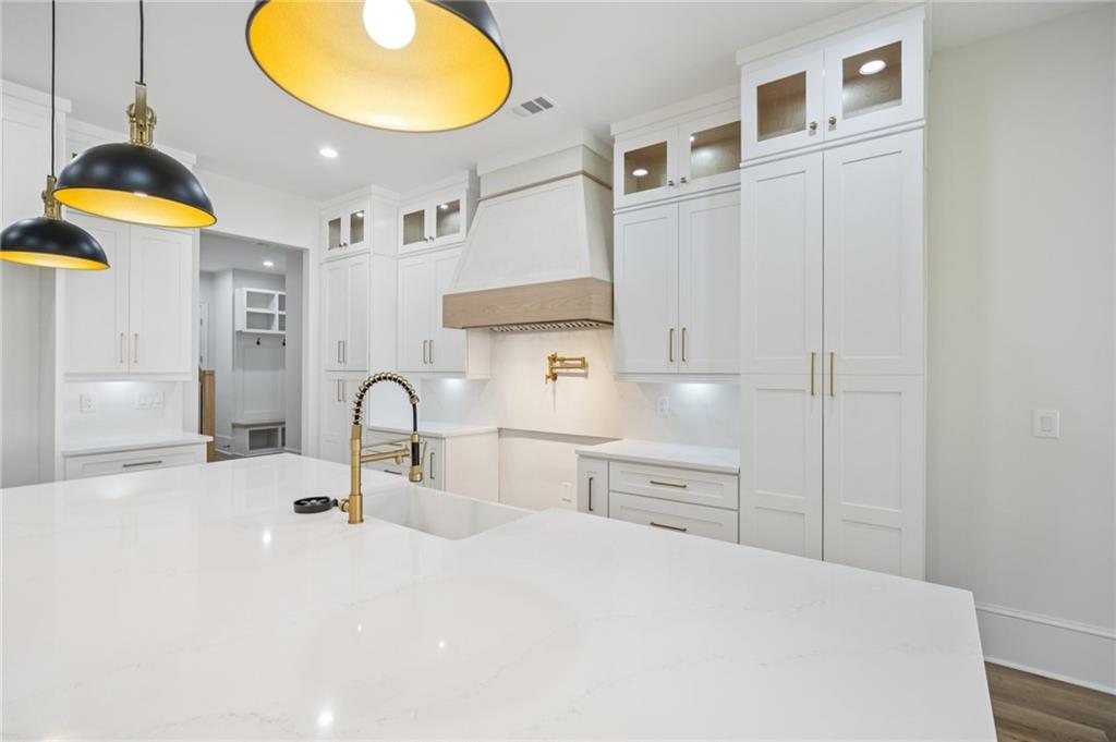4546 Fawn Path Gainesville, GA 30506 - Photo 22 of 64 a kitchen with stainless steel appliances a sink a stove and a wooden floors