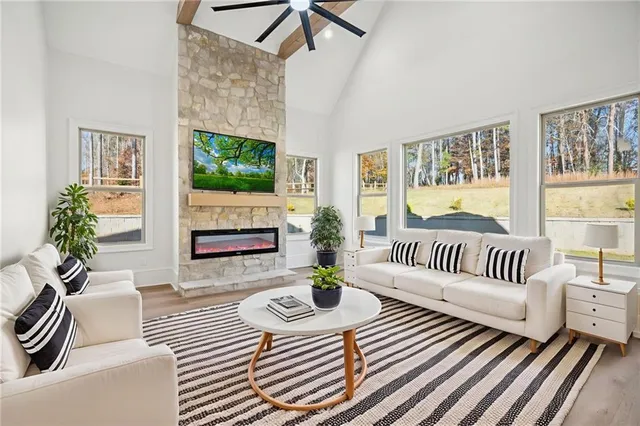 a spacious bathroom with a tub shower and mirror
