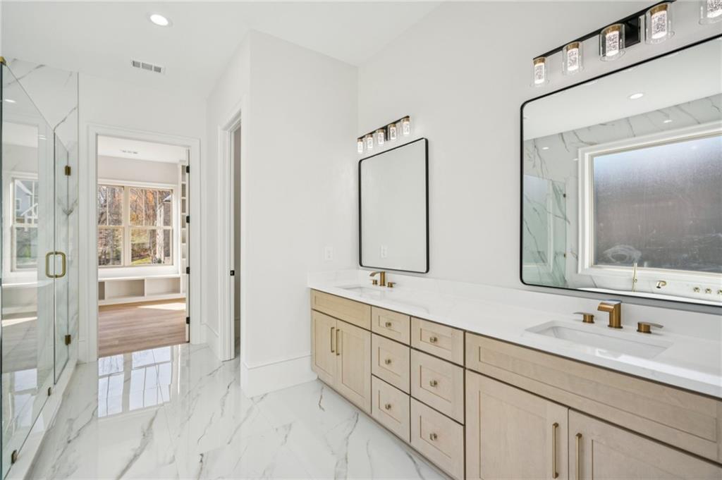 4546 Fawn Path Gainesville, GA 30506 - Photo 33 of 64 a bathroom with double sink and a mirror