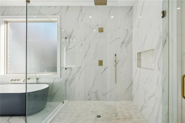 a bedroom with a large bed and a flat screen tv