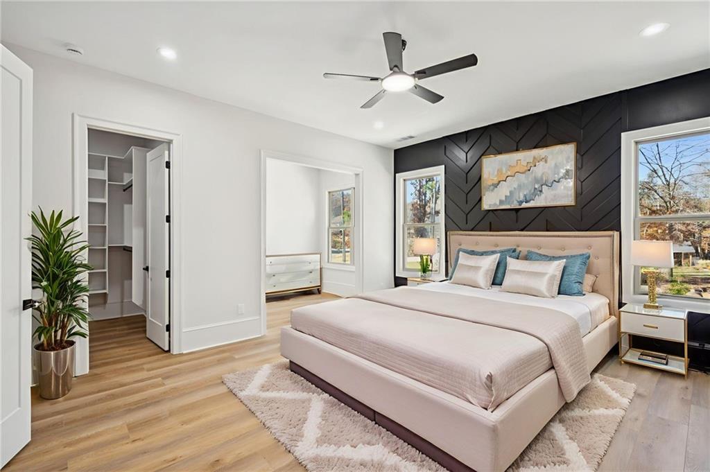 4546 Fawn Path Gainesville, GA 30506 - Photo 44 of 64 a bedroom with a large bed and a flat screen tv