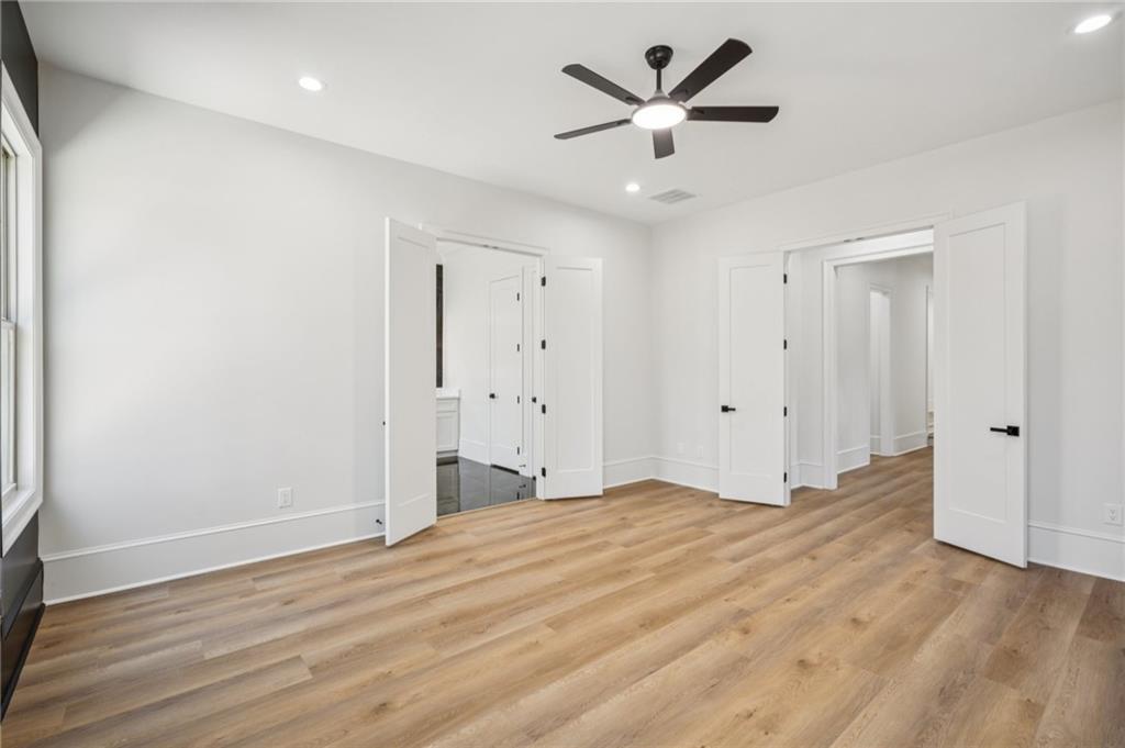 4546 Fawn Path Gainesville, GA 30506 - Photo 45 of 64 a view of a big room with wooden floor and a ceiling fan