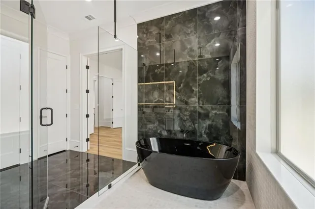 a backyard of apartments with large trees