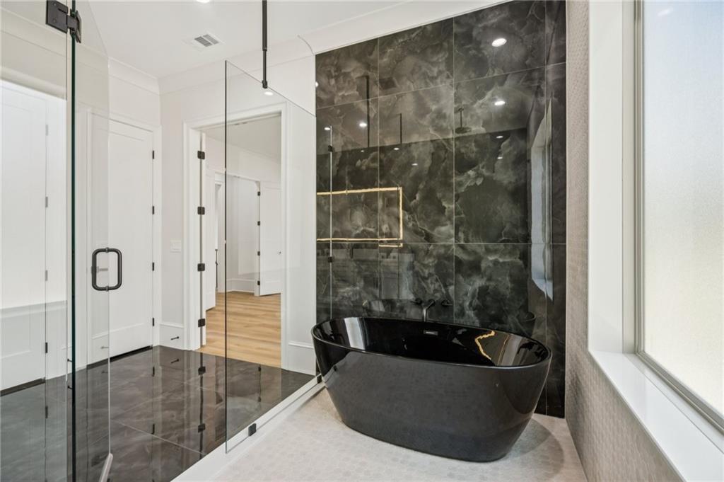 4546 Fawn Path Gainesville, GA 30506 - Photo 47 of 64 a bathroom with a tub shower and sink