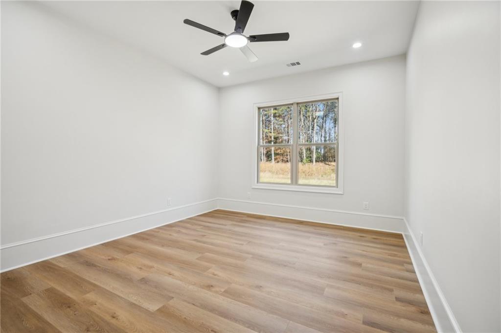 4546 Fawn Path Gainesville, GA 30506 - Photo 48 of 64 wooden floor in an empty room with a window