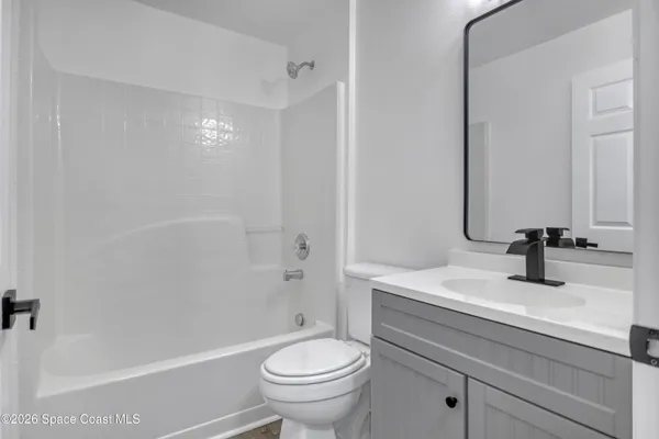 a bathroom with a sink a toilet and a bathtub
