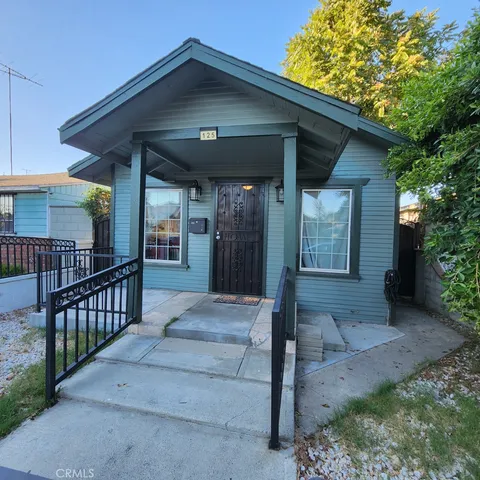 a view of house with porch