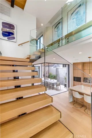 a large bedroom with a large bed and a large window