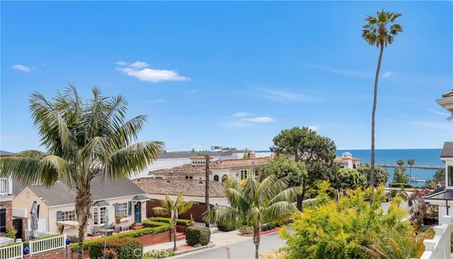 a bedroom with furniture and large windows