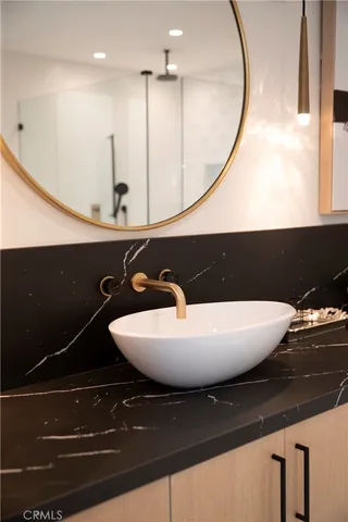 a view of a bathroom with a tub and mirrors