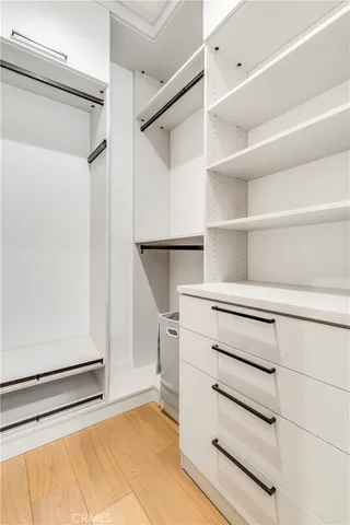 a living room with stainless steel appliances kitchen island granite countertop furniture and a large window