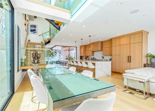 a living room with a couch a flat screen tv and a fireplace