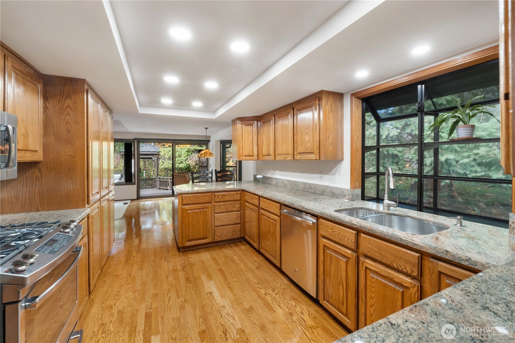 36607 9th Avenue Southwest Federal Way, WA 98023 - Photo 13 of 40 a large kitchen with kitchen island granite countertop a large window