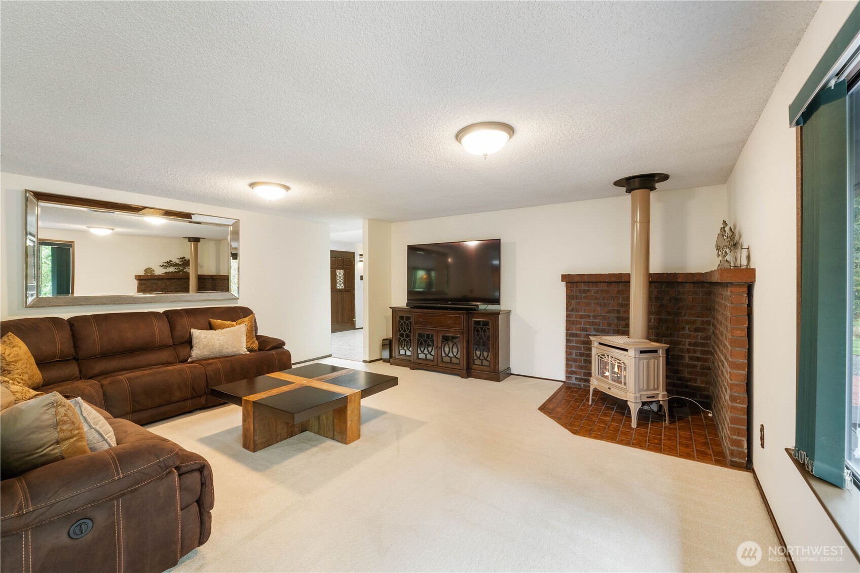 36607 9th Avenue Southwest Federal Way, WA 98023 - Photo 18 of 40 a living room with furniture and a flat screen tv