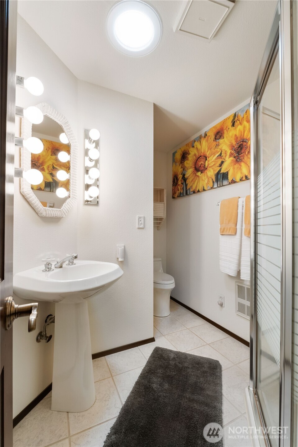 36607 9th Avenue Southwest Federal Way, WA 98023 - Photo 31 of 40 a bathroom with a sink and mirror with toilet
