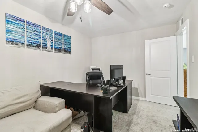 a reading room with furniture and wooden floor