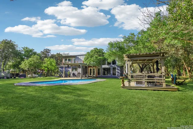 a view of a house with a yard porch and sitting area