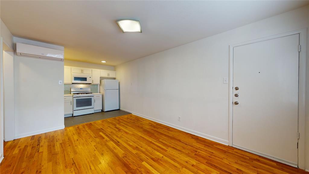 2405 Abrams Road, Unit A1 Dallas, TX 75214 - Photo 2 of 9 a view of a kitchen with wooden floor