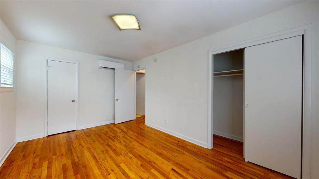 2405 Abrams Road, Unit A1 Dallas, TX 75214 - Photo 7 of 9 a view of empty room with wooden floor