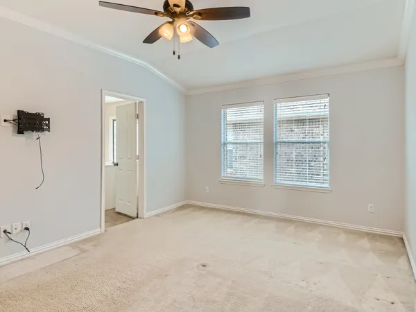 a bathroom with a granite countertop sink and a bathtub