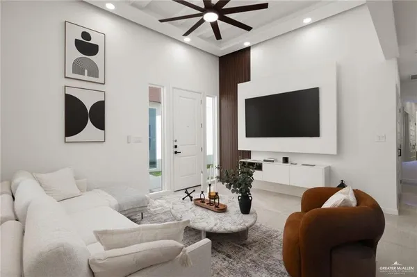 a living room with furniture and a flat screen tv