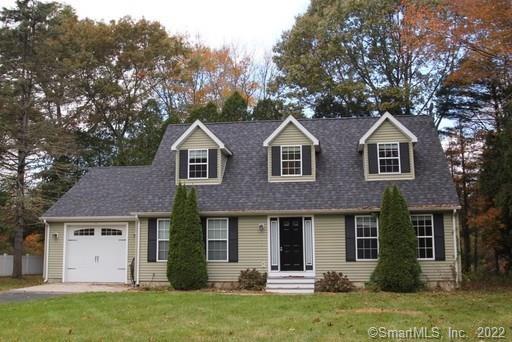 349 Buddington Road Groton, CT 06340 - Photo 1 of 1 a front view of a house with a yard and garage