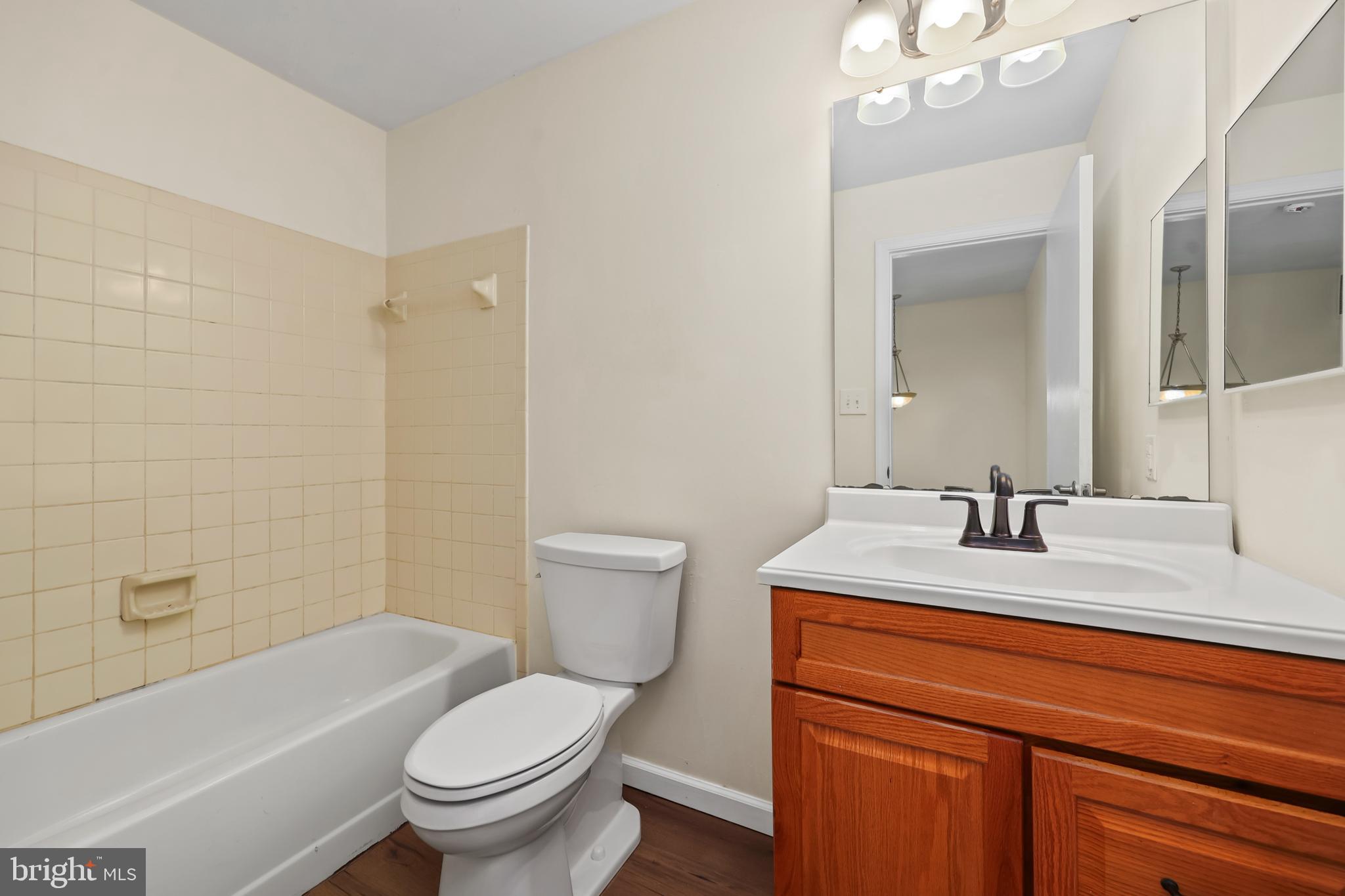 15372 Gunsmith Terrace Woodbridge, VA 22191 - Photo 16 of 37 a bathroom with a sink a toilet and shower