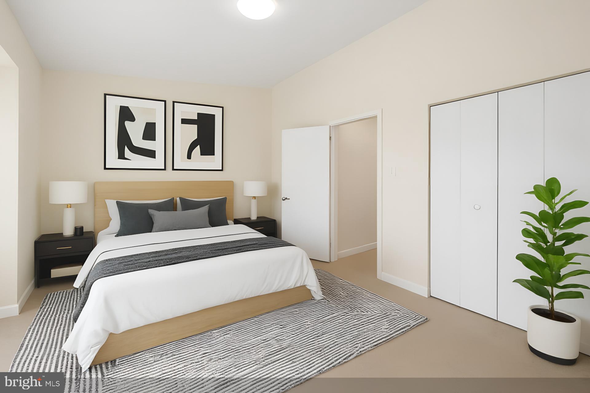 15372 Gunsmith Terrace Woodbridge, VA 22191 - Photo 18 of 37 a bedroom with a large bed and a potted plant