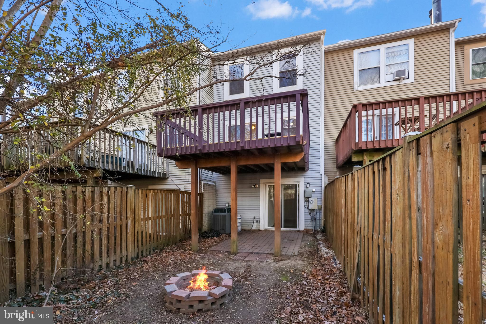15372 Gunsmith Terrace Woodbridge, VA 22191 - Photo 28 of 37 a view of a house with a deck and furniture