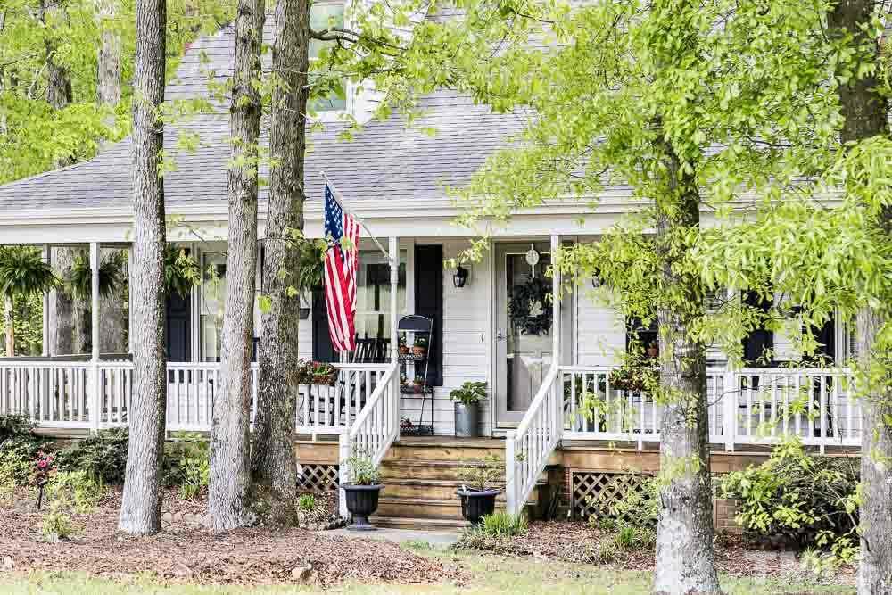 1590 Ranch Road Clayton, NC 27520 - Photo 1 of 26 a front view of a house with a porch