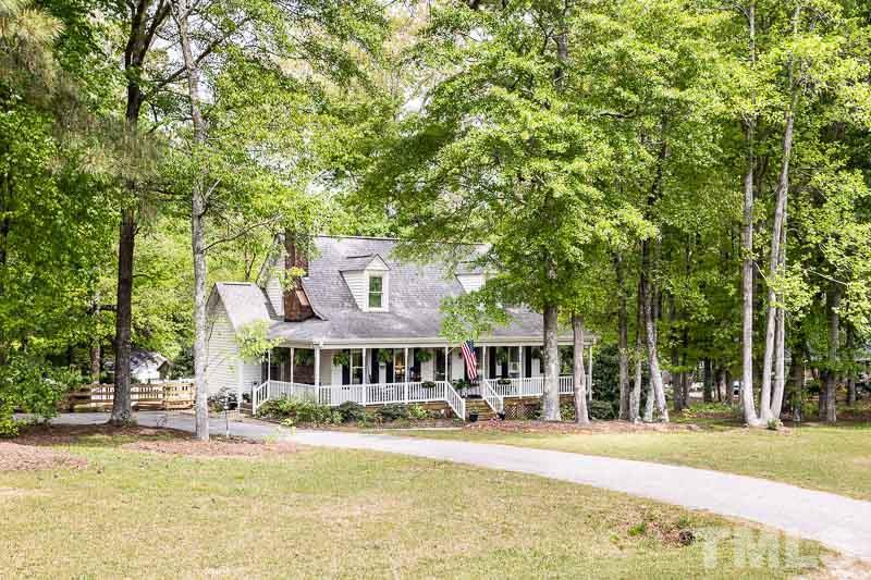1590 Ranch Road Clayton, NC 27520 - Photo 2 of 26 a front view of a house with a yard