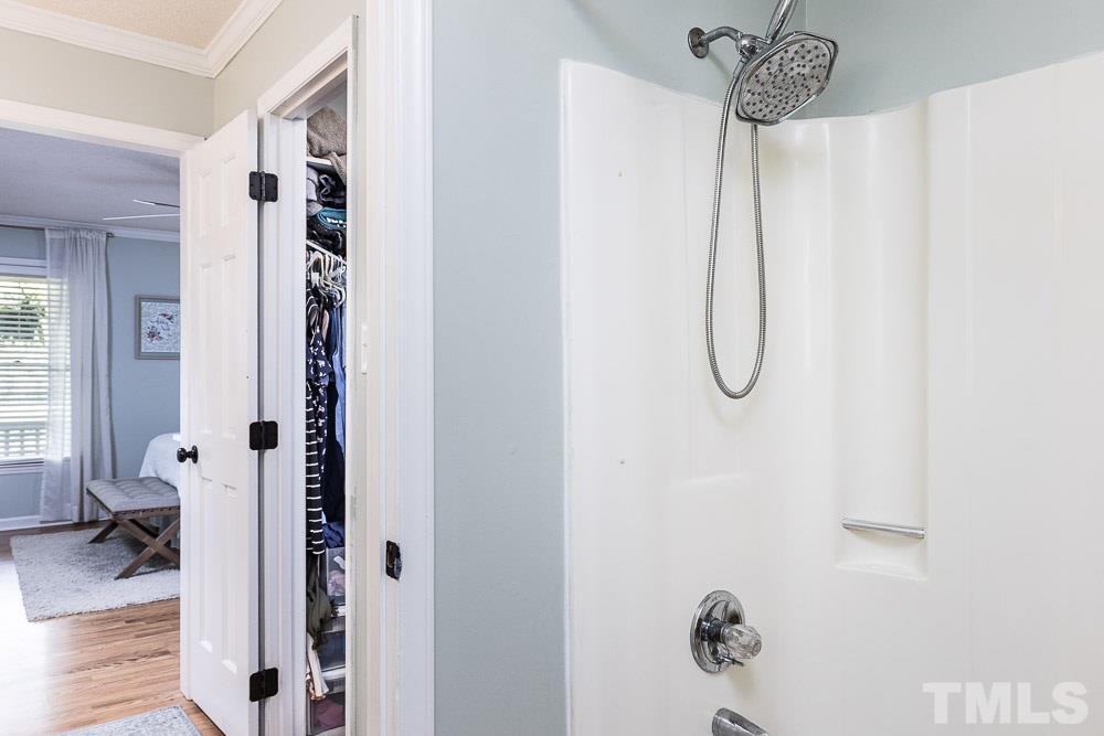 1590 Ranch Road Clayton, NC 27520 - Photo 16 of 26 a bathroom with a shower