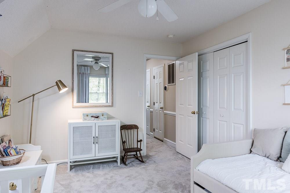 1590 Ranch Road Clayton, NC 27520 - Photo 19 of 26 a bedroom with a bed and a desk