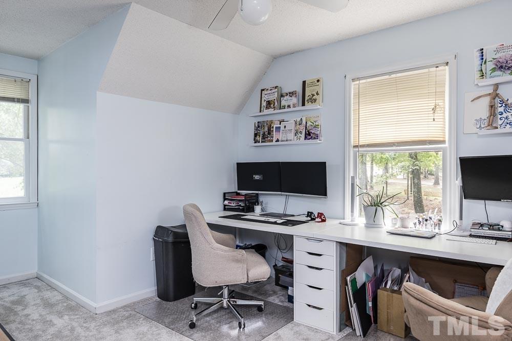 1590 Ranch Road Clayton, NC 27520 - Photo 21 of 26 a view of a workspace with furniture and a window