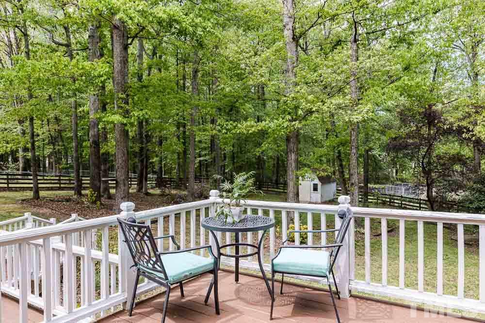 1590 Ranch Road Clayton, NC 27520 - Photo 22 of 26 a view of a chair and table in the balcony