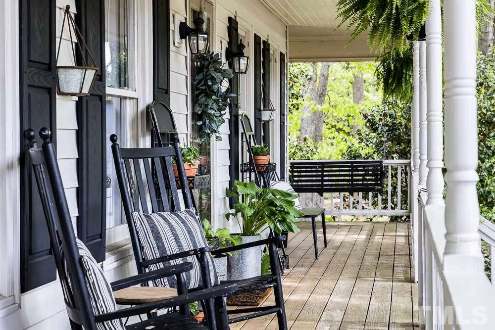 1590 Ranch Road Clayton, NC 27520 - Photo 5 of 26 a view of balcony with wooden floor and outdoor seating